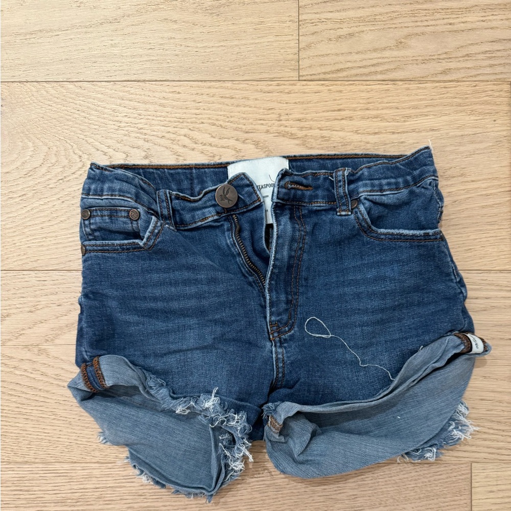 These are dark blue kids One Teaspoon jean shorts.